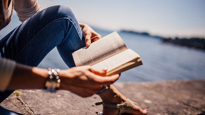 girl holding a book