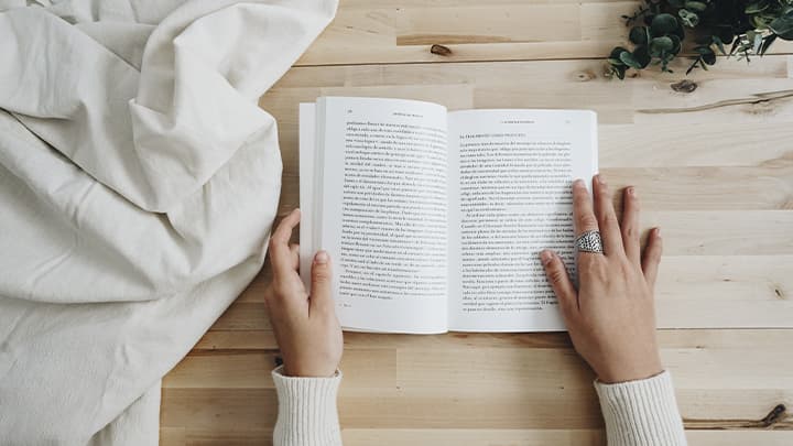 Book in hand and tablecloth